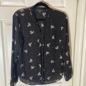 Women’s blouse black w/floral designs throughout. Size: 10